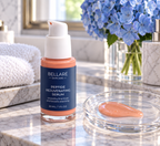 Bellaré Peptide Rejuvenating Serum beside its silky coral serum texture on a marble bathroom vanity.
